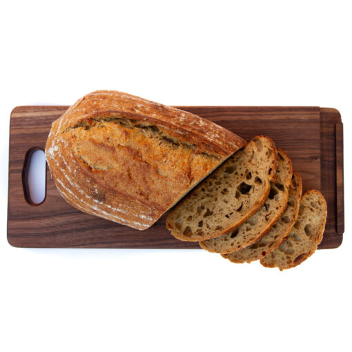 Walnut JonoKnife Compact breadboard with sliced bread